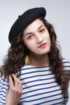 Young Woman with French Style Beret Hat and Striped T-shirt