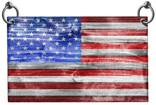 Wooden USA flag hanging on to two steel ring isolated on white background with clipping path