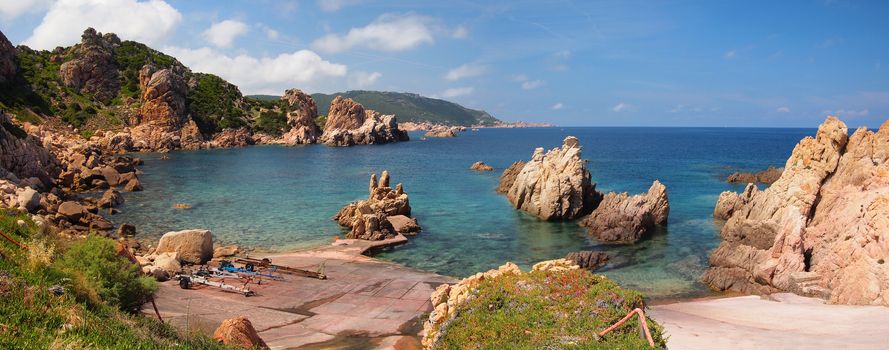 Typical clear water and red rocks on the north coast of Sardinia, Italy at Paradise Beach.