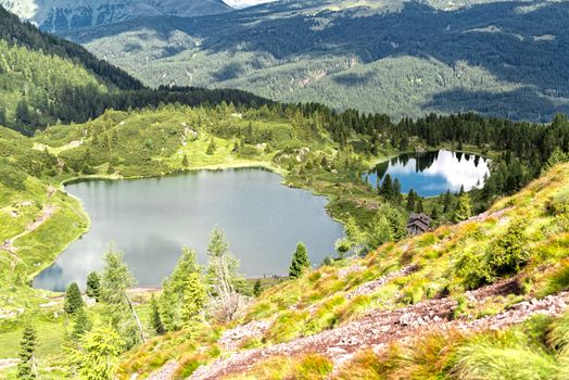 aerial view of the lakes of Colbricon near Passo Rolle in a beautiful summer day, Trentino - Italy