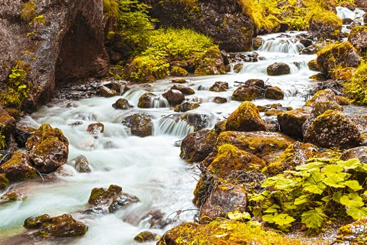 long time exposure on the river in Sottoguda gorges with autumn colors, Veneto - Italy