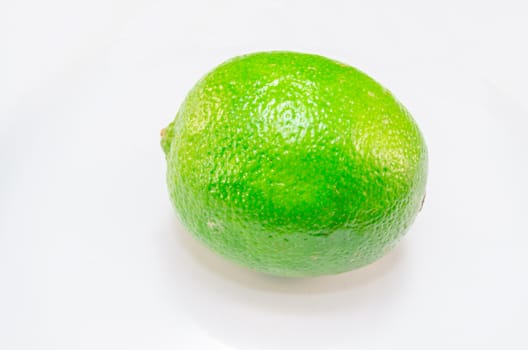 Green lime, lemon isolated on a white background.