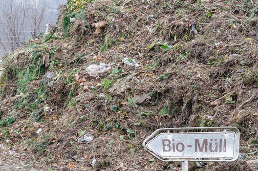Compost with organic waste on a large recycling plant for organic waste.
