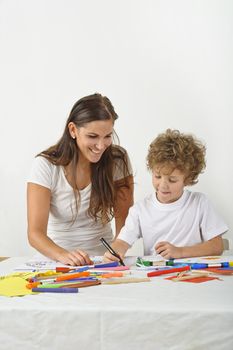 Mother teaches her child how to draw