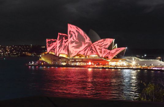 SYDNEY, AUSTRALIA - JUNE 3, 2013;  Sydney Opera house with lovely red patterns, during Vivid Sydney and Canon Australia special photo walk where we had access from MCA building