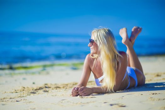 Young Woman in Bikini on a Tropical Sand Beach
released