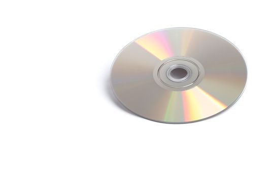 A shiny silver DVD sitting alone on a white background.