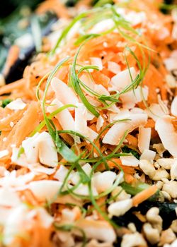 Close up of salad of carrots and cashew nuts