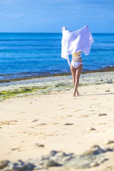 Young Woman in Bikini on a Tropical Sand Beach
released