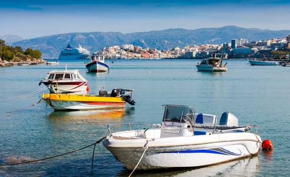 Motor boats and a cruise ship off the coast of Agios Nikolaos. Crete, Greece

