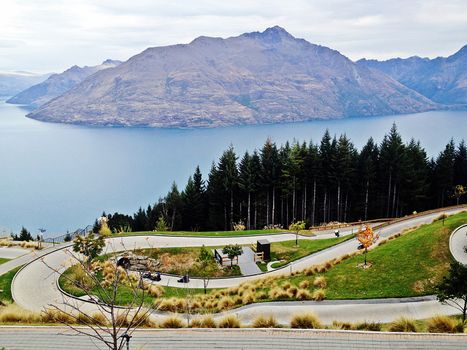 A superb view of luge line with lake and mountain at Skyline, Queenstown, New Zealand