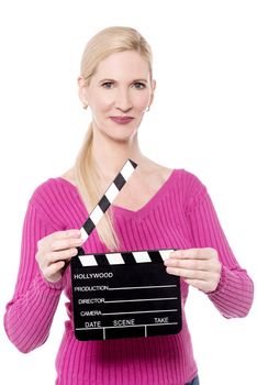 Attractive woman holds an open film slate
