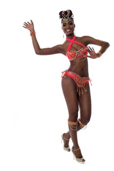 Cheerful samba woman dancing over white