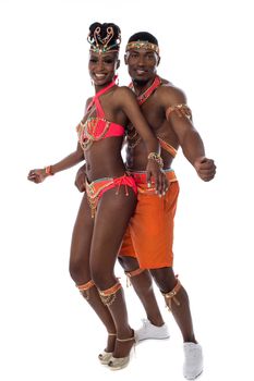Full length of couple performing samba dance