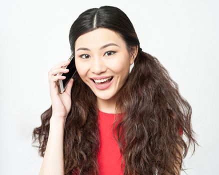 Cheerful woman speaking on her cellphone