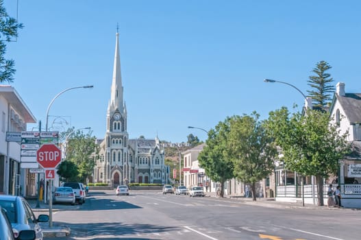 GRAAFF REINET, SOUTH AFRICA - JANUARY 6, 2015: Late afternoon street scene.  The Dutch Reformed Church, built 1885-1887, is one of more than 200 buildings in the town declared as a national monument