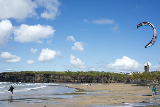 lone kite surfer getting ready at ballybunion beach on the wild atlantic way