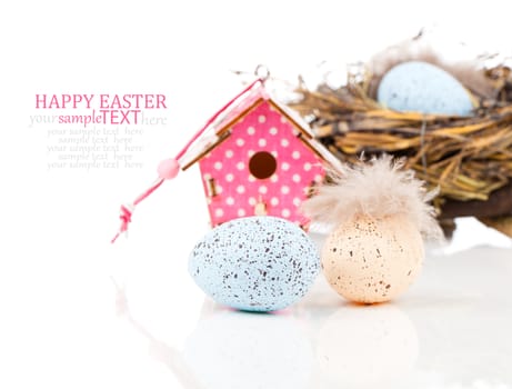 easter decoration on white background with color egg and with birdhouse, with space for text