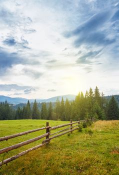 Summer mountain village landscape with blue sky