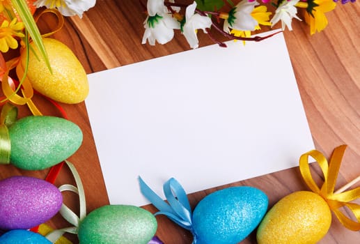 Easter greeting card with flowers and colorful eggs