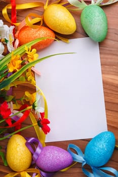 Easter greeting card with flowers and colorful eggs