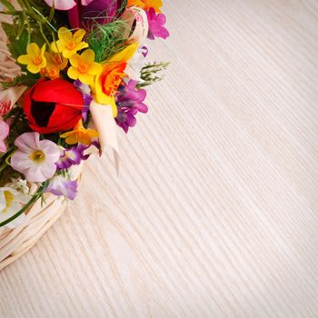 artifical flowers on a wooden background