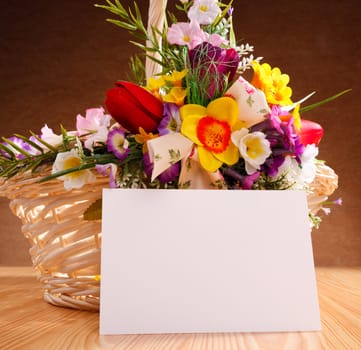 decorated flowers basket vith with blank greeting card