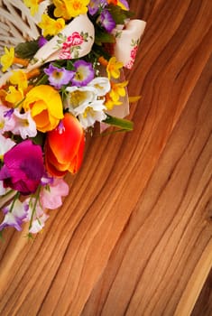 artifical flowers on a wooden background