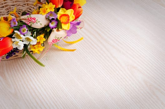 artifical flowers on a wooden background