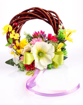 wreath of twigs and flower composition on a white background
