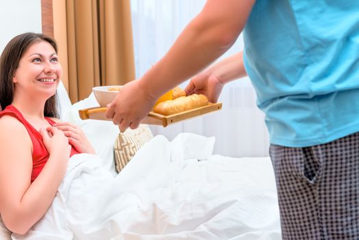 husband brought his wife breakfast in bed