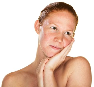 Daydreaming woman with palm on cheek over white background