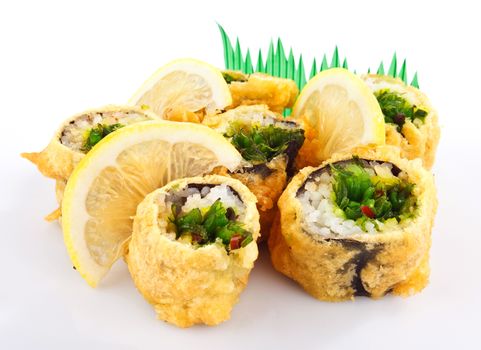 sushi roll fried in tempura batter with lemon isolated