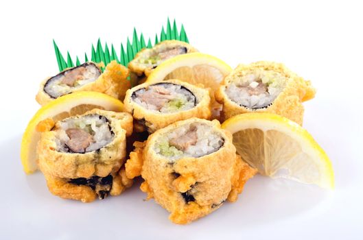 sushi roll fried in tempura batter with lemon isolated