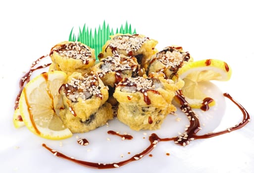 sushi roll fried in tempura batter with sauce