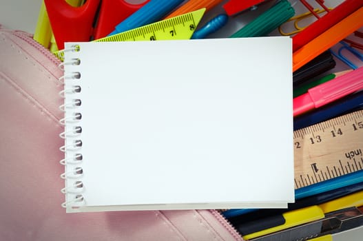 Notebook with stationary objects, copyspace
