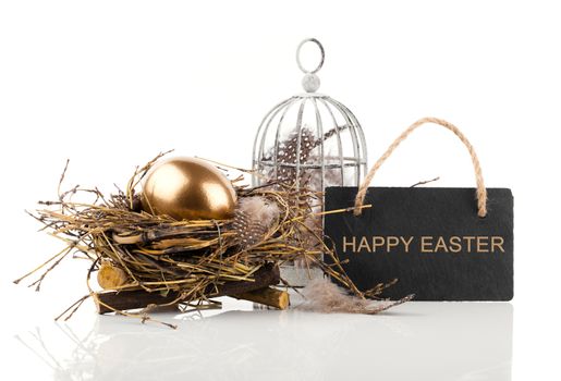 golden egg in nest with blackboard with space for text, on white background