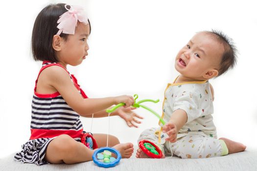 Two Asian Chinese  children playing in white background