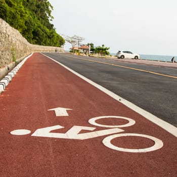 Bicycle road sign and arrow in outdoors