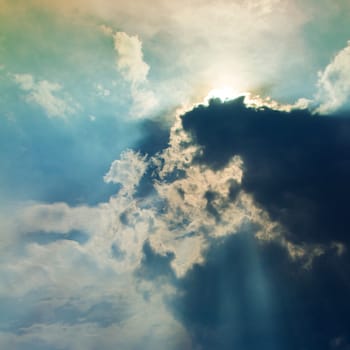 View of clouds in sky with rays of light