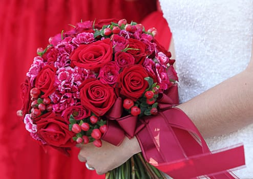 Wedding bouquet in hands of the bride