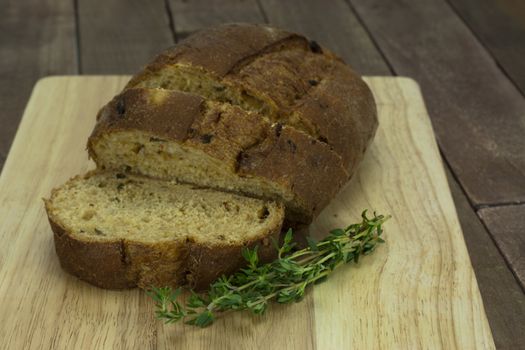 Loaf of wholemeal brown bread cut ready to serve