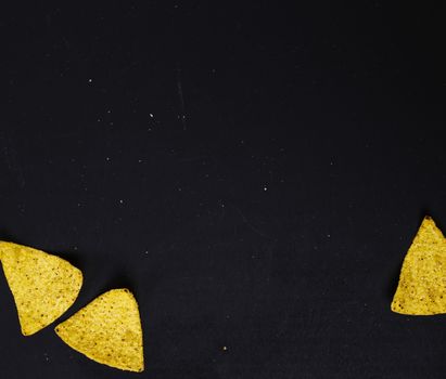 Potato chips on a black background