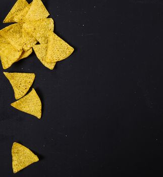 Potato chips on a black background