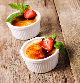 Dessert. Delicious creme brulee on the table