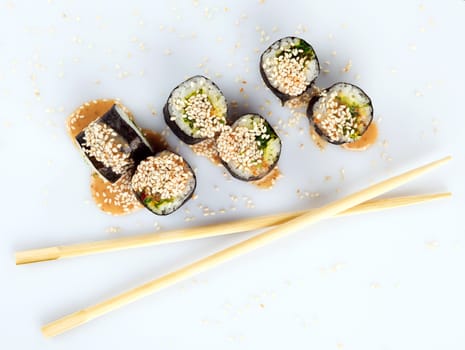 Traditional japanese sush with two Chopsticks isolated on white background