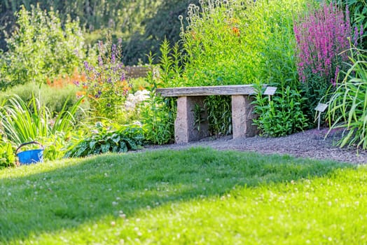 Stone and wood bench in garden