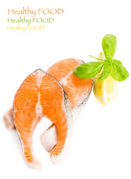 Salmon cuts with basil and lemon isolated on white, copy space