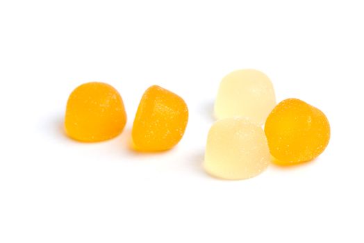 Fruity gummy candy covered in sugar isolated on a white background.