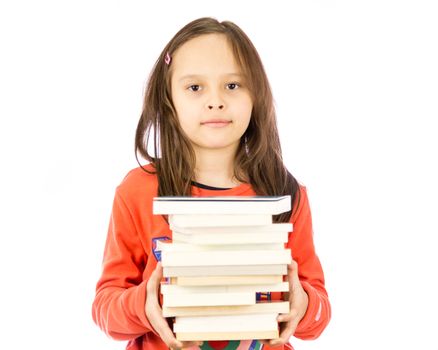 Young girl carrying a pile of books
